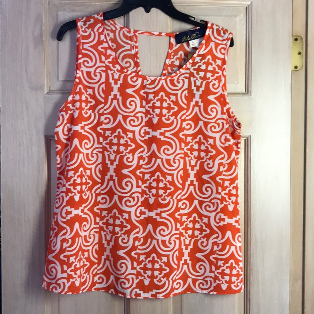 NWT Francesca’s orange & white patterned blouse
